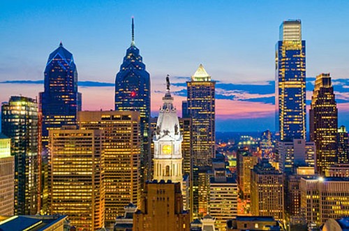 The Philadelphia skyline, showing One Liberty Place (with the red dot), City Hall (center), and the Comcast Center looming at right. 